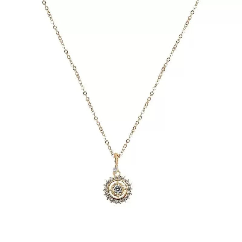 Delicate diamond-studded pendant necklace with a circular design.