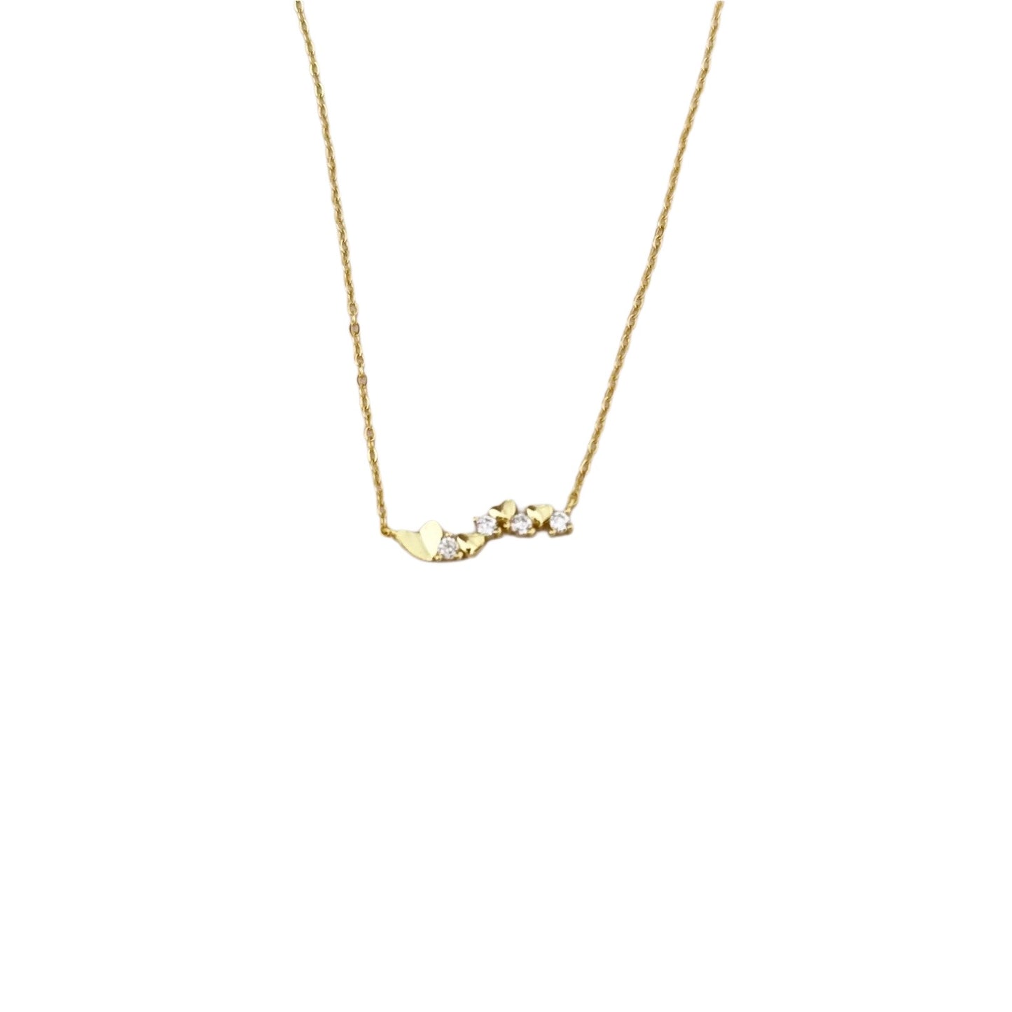 Gold necklace with small heart-shaped pendants and clear stones.