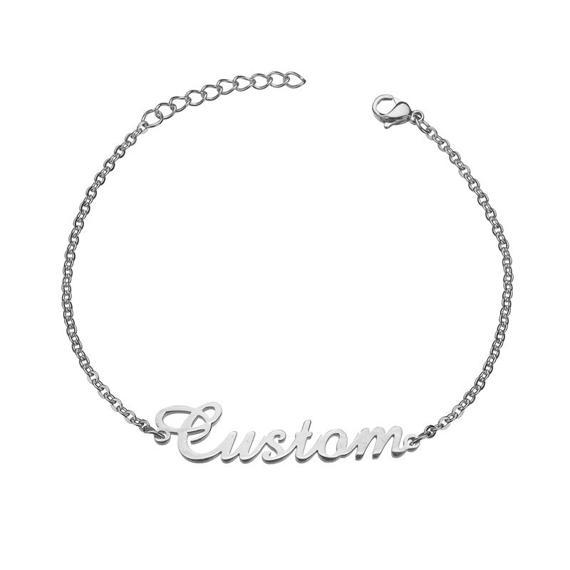 Engravable gold bracelet featuring a personalized name design, elegantly crafted for a stylish and unique accessory.