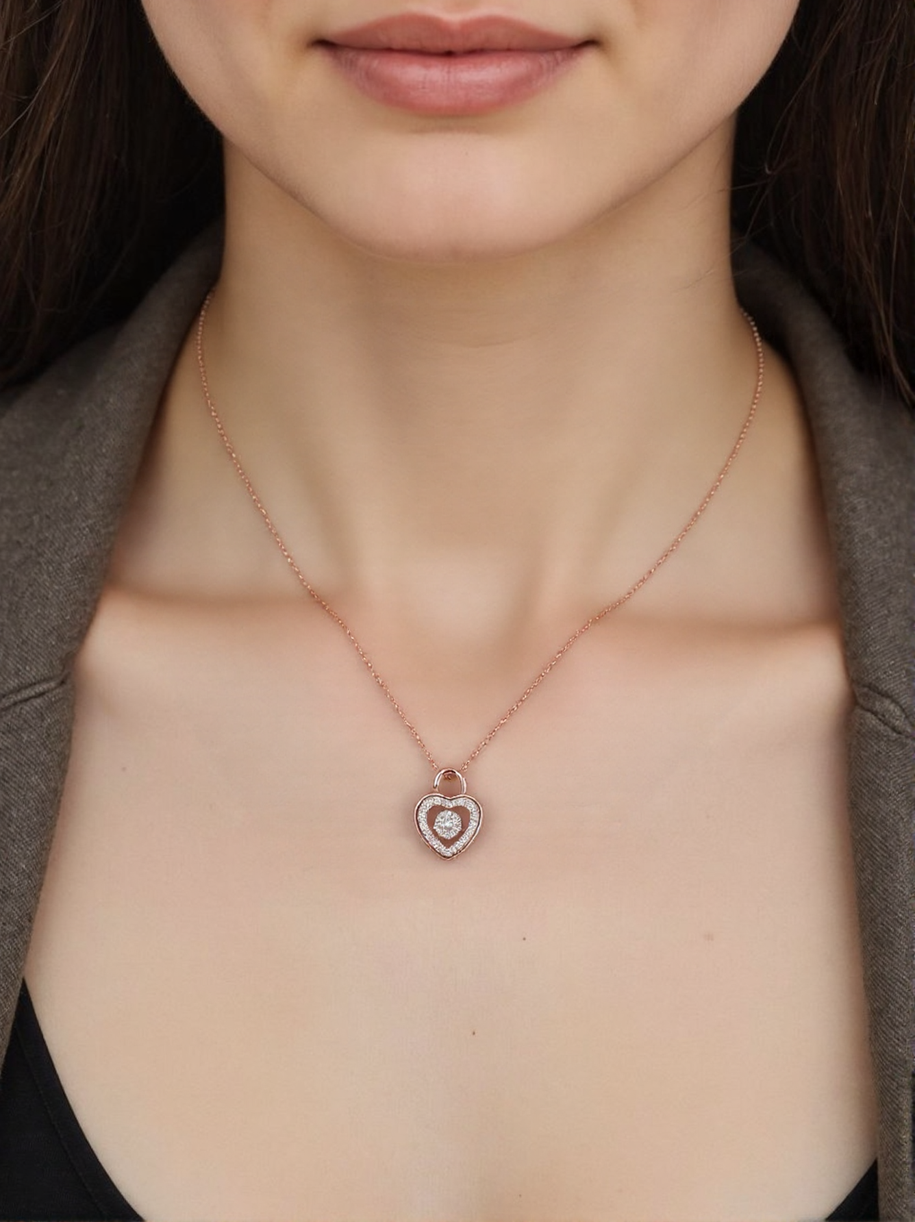 Close-up of a woman wearing Heart-shaped pendant necklace with a lock design and small diamonds.