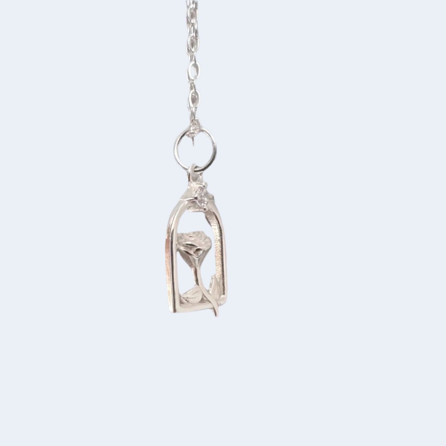 Close-up of a flower pendant necklace