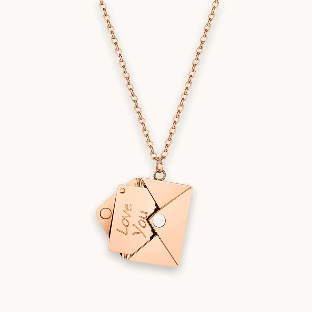 Rose gold necklace featuring a delicate envelope charm, elegantly designed for a stylish and modern look.