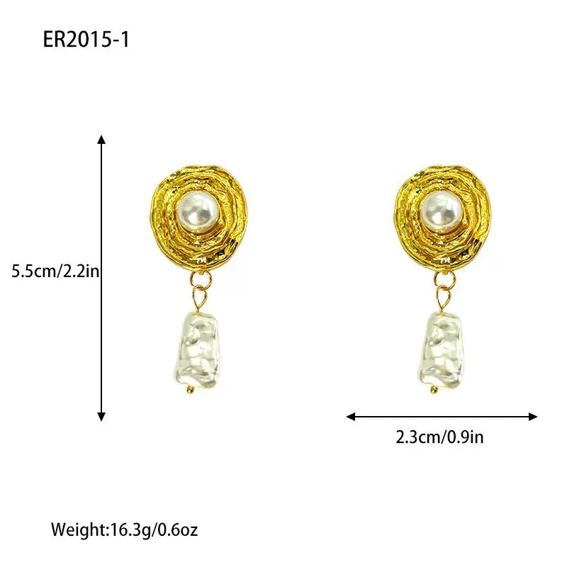 Gold-toned earrings with textured circular tops and dangling white baroque pearls.