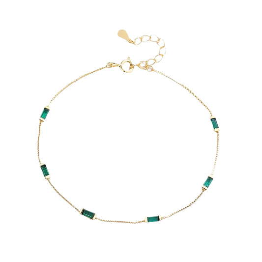 Delicate silver gold plated  bracelet with six emerald-cut green stones.