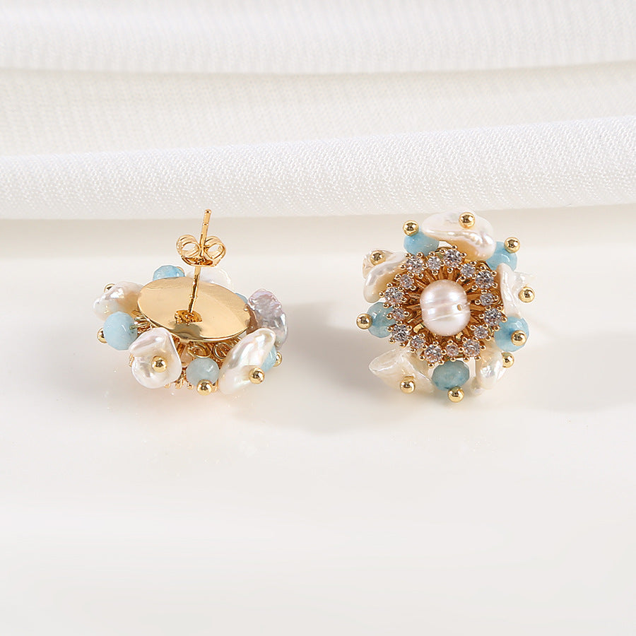 Elegant earrings adorned with blue and gold beads, showcasing a stylish and vibrant accessory.