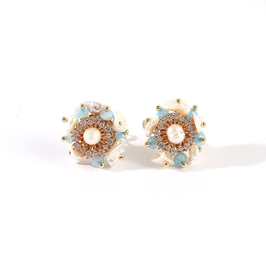 Elegant earrings adorned with blue and gold beads, showcasing a stylish and vibrant accessory.