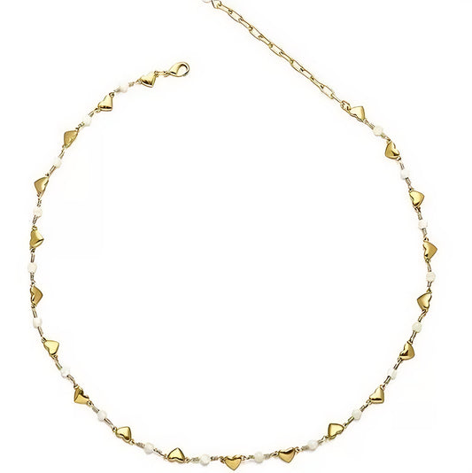 Gold chain adorned with small heart-shaped charms, elegantly showcasing a delicate and romantic design.