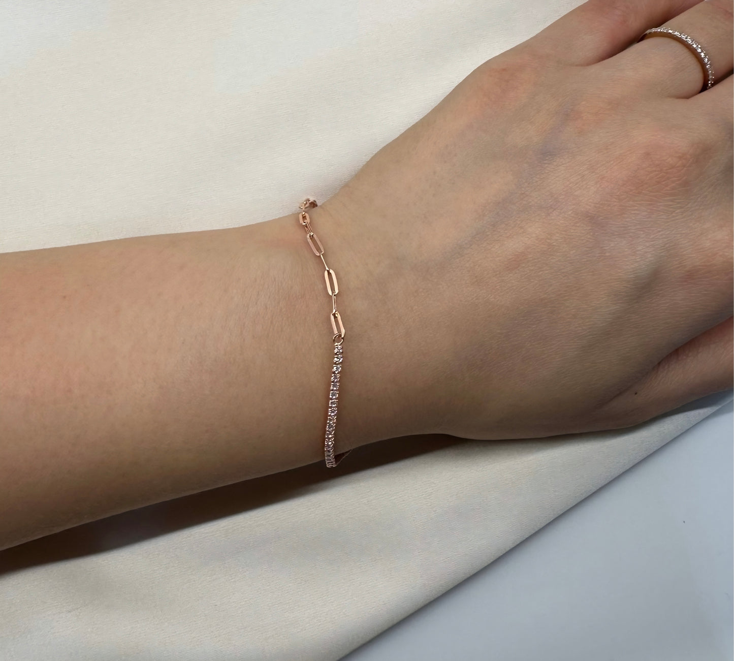 Rose gold bracelet with a diamond tennis chain.