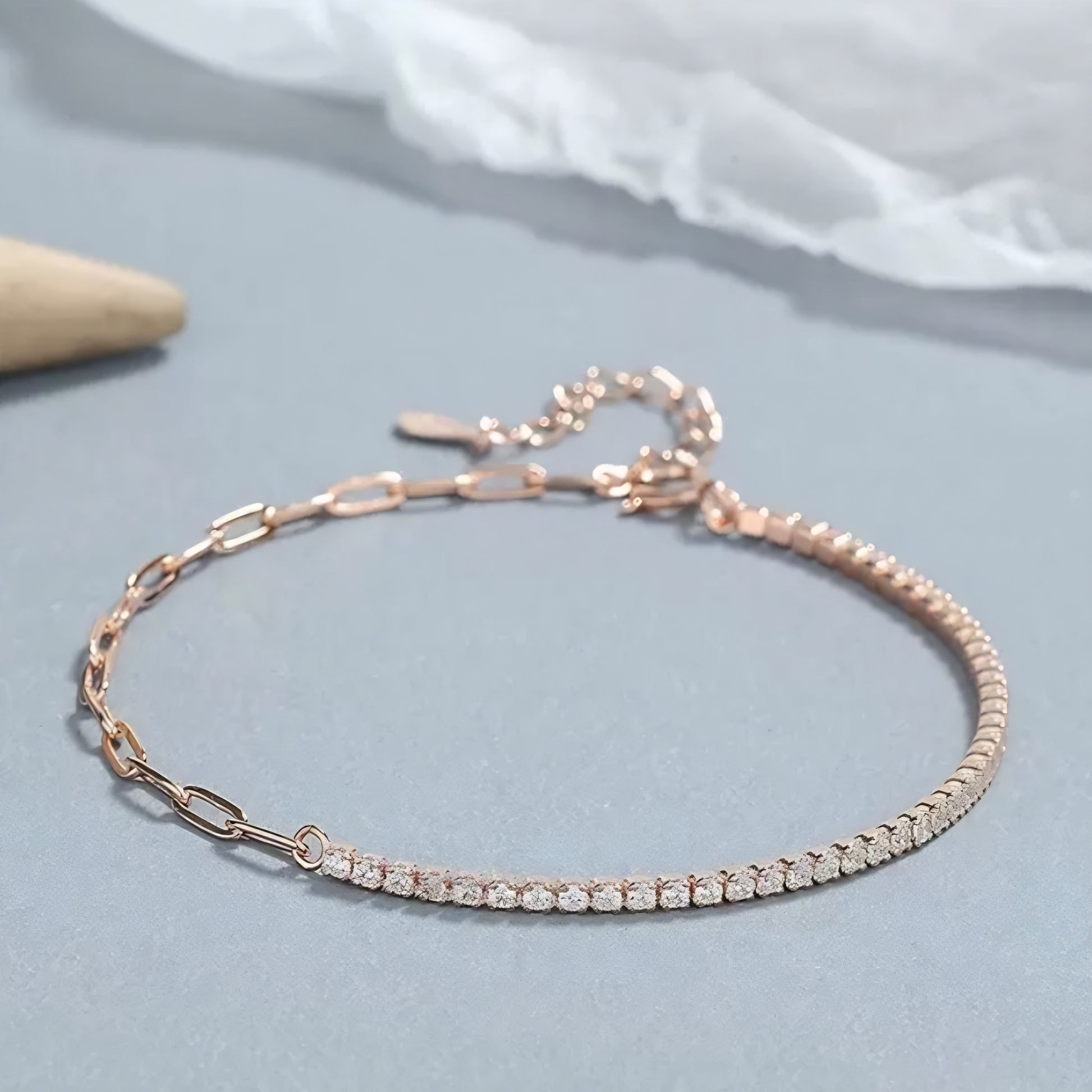 Rose gold bracelet with a diamond tennis chain.