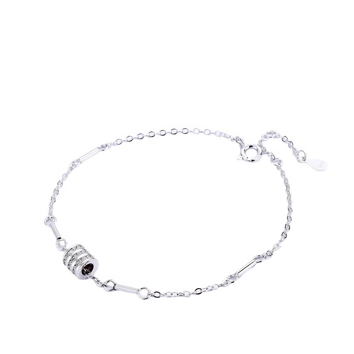 Rose gold bracelet with a diamond-studded cylinder charm and connecting bar links.