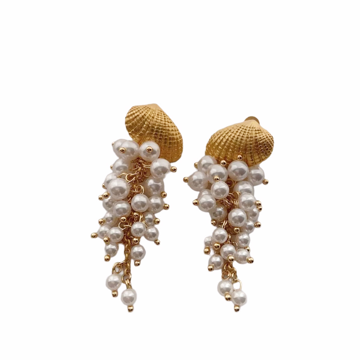 Gold-tone seashell earrings with cascading pearl accents.